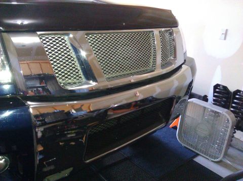 2008 Nissan Titan - Front view of a 2008 Nissan Titan's custom grille with chrome trim and mesh.