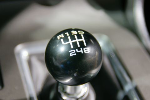 1993 Ford Taurus - Close-up of a manual transmission shift knob showing the gear pattern.