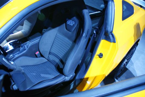 1993 Ford Taurus - Interior view of a yellow car Recaro seats with "BOSS 302" embroidered on the headrest.