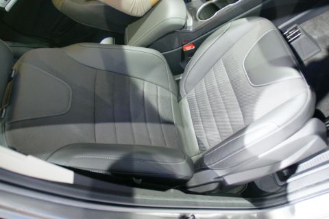 1993 Ford Taurus - Interior view of gray fabric and leather seats with visible stitching patterns.