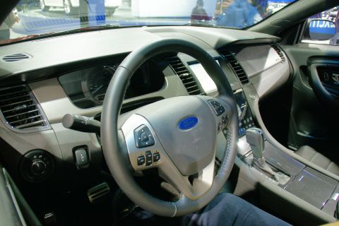 1993 Ford Taurus - The interior of a Ford Taurus features a modern dashboard and steering wheel with integrated controls.