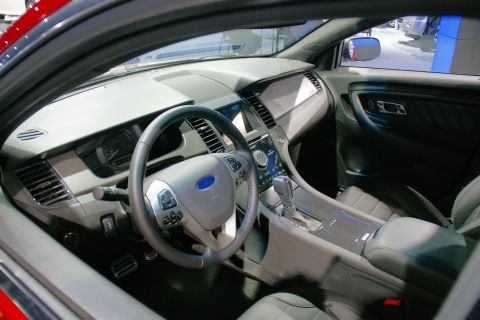 1993 Ford Taurus - Interior view of a car's dashboard, steering wheel, and center console.