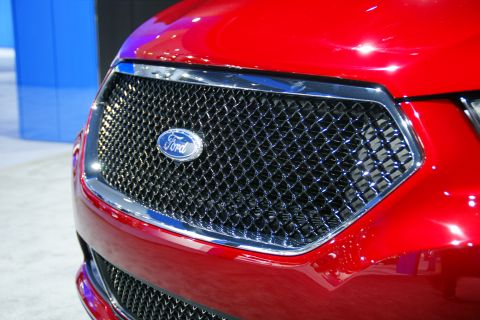 1993 Ford Taurus - Close-up of a red Ford Taurus grille, likely a 2010 model, at an auto show.