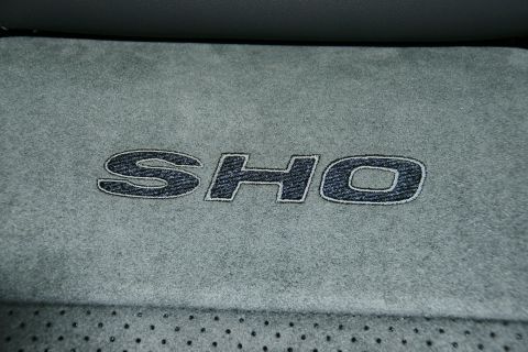 1993 Ford Taurus - Close-up of the SHO emblem on the interior upholstery of a car.
