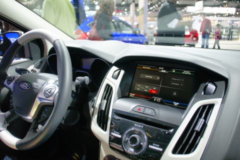 1993 Ford Taurus - The interior of a modern car is shown, a touchscreen display and a multi-function steering wheel.