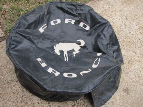 1995 Ford Bronco - Spare tire cover displays Ford Bronco branding and the iconic running horse logo.