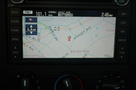 2008 Ford Mustang - The car's infotainment system displays a map of Midland Park, NJ, along with radio station information.