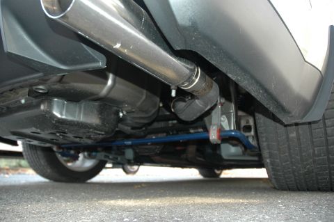 2008 Ford Mustang - Undercarriage view of a vehicle's exhaust and suspension system.