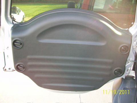 1999 Isuzu Vehicross - Spare tire cover with latches, likely from an SUV.
