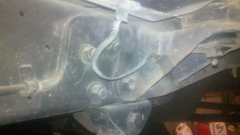 1988 Ford Bronco - Undercarriage view showing suspension components and frame structure.