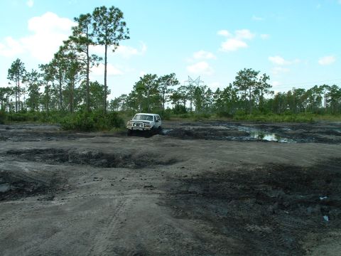 1995 Ford Bronco - This 1995 Ford Bronco is navigating a challenging muddy terrain.