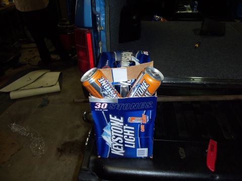 1985 Ford Bronco - A case of Keystone Light beer sits in the cargo area of a vehicle.