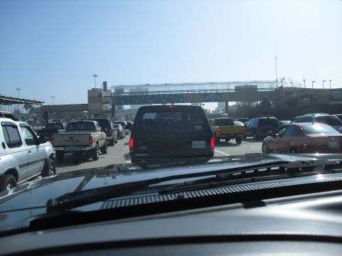 1986 Ford Bronco - A black SUV is seen in traffic, displaying the number '880' on its rear window.