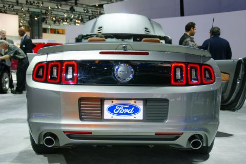 1993 Ford Taurus - Rear view of a silver Ford Mustang convertible at an auto show.