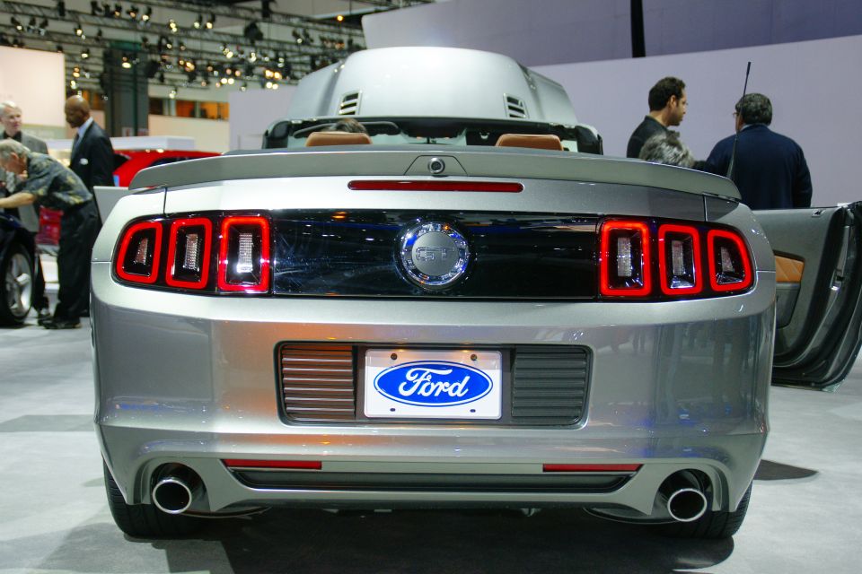 Silver Ford Mustang convertible rear view with LED taillights and Ford logo on license plate