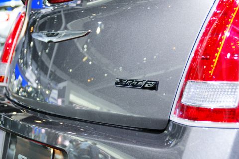 1993 Ford Taurus - Close-up of the SRT-8 badge on the rear of a gray vehicle.