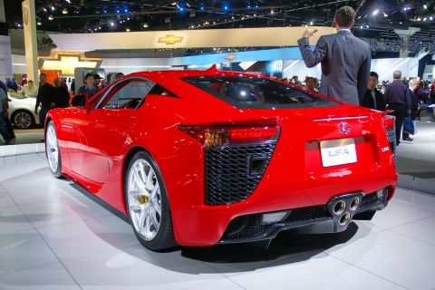 1993 Ford Taurus - Red Lexus LFA sports car on display at an auto show.