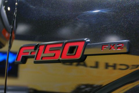 1993 Ford Taurus - Close-up of an F-150 FX2 badge on a dark vehicle.