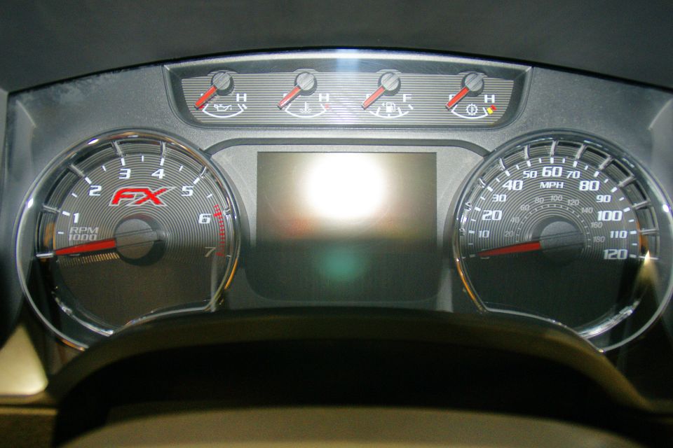 Dashboard gauges with FX logo on tachometer and speedometer up to 120 MPH