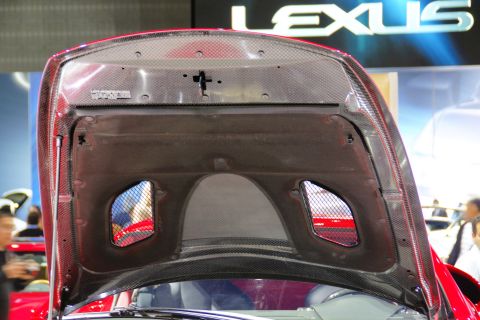 1993 Ford Taurus - Underside of a car hood with a prominent Lexus logo visible in the background.