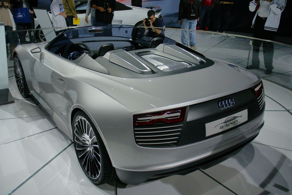 Silver convertible concept car with 'e-tron' badge, rear 3/4 view
