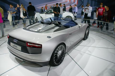 1993 Ford Taurus - Silver convertible concept car on display at an auto show, unique taillights and a design.
