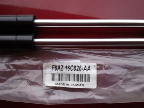 1998 Ford Crown Victoria - Hood struts in packaging, part number F8AZ-16C826-AA, made in Taiwan.