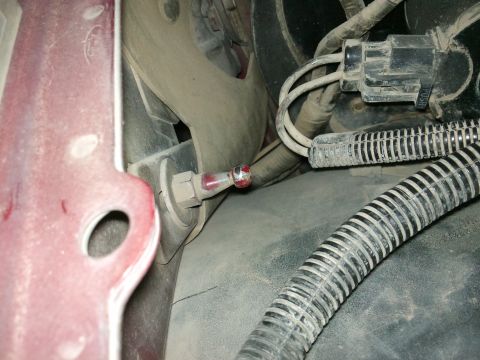 1998 Ford Crown Victoria - Detail of a hood latch mechanism, showing wires and tubing, with a Supermotors.net watermark.