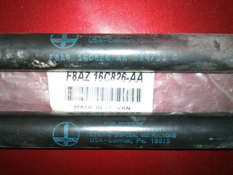 1998 Ford Crown Victoria - Automotive hoses with part number F8AZ-16C826-AA and "MADE IN TAIWAN" printed on labels.