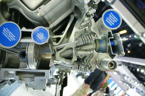 1993 Ford Taurus - Cutaway engine display with informational labels about internal components.