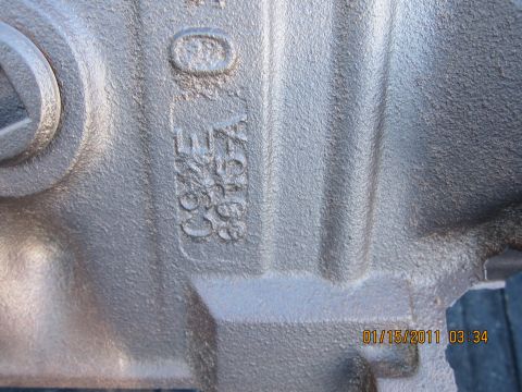 1969 Ford Mustang - Metal part with embossed casting numbers C9ZE-A 6030-A visible.