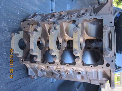 1969 Ford Mustang - Engine block with bearing caps installed. Date stamp visible on the side.
