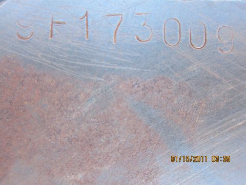 1969 Ford Mustang - A metal part displays stamped identification numbers SF173009.