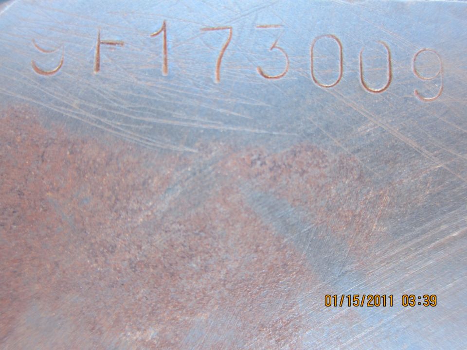 Stamped metal part with numbers SF173009