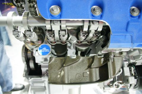 1993 Ford Taurus - Engine cutaway displays internal workings and a label indicating high-temperature exhaust valves.