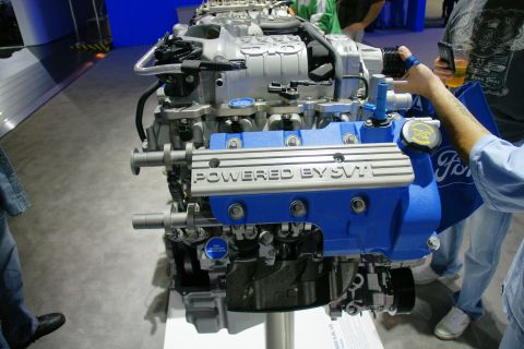 1993 Ford Taurus - A Ford SVT engine is displayed, with text on the valve covers and a Ford logo visible.