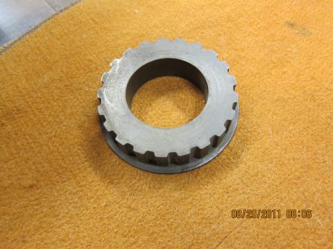 1969 Ford Mustang - A metal gear with teeth is shown on an orange surface, with a date stamp and website visible.