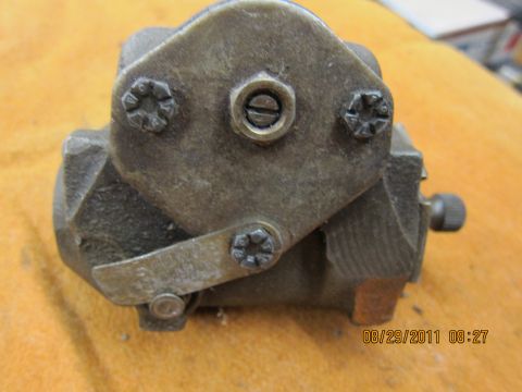 1969 Ford Mustang - A close-up view of a single, weathered brake caliper component, likely from an older vehicle.