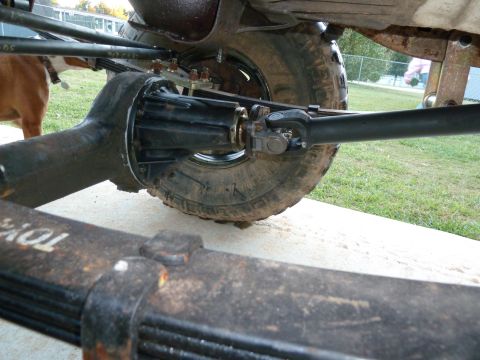 1992 Ford Mustang - Close-up view of a vehicle's rear axle and suspension components.