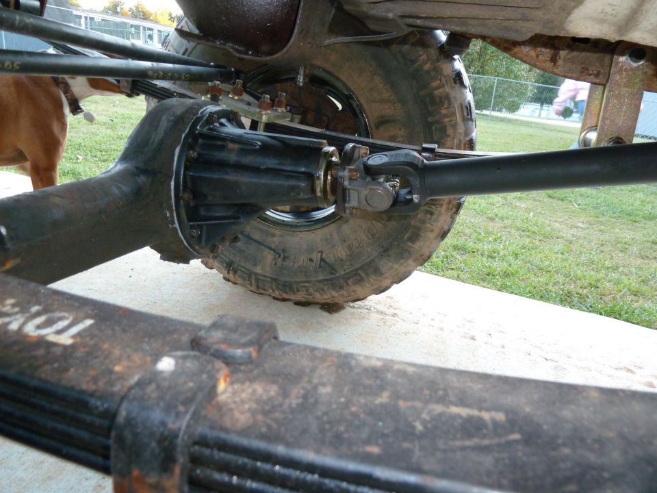 Rear axle assembly and leaf springs with 'TOYO' visible on the spring