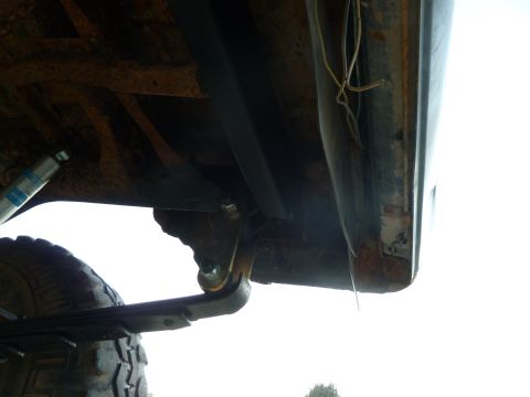 1992 Ford Mustang - Close-up view of the undercarriage, highlighting the leaf spring and shock absorber assembly.
