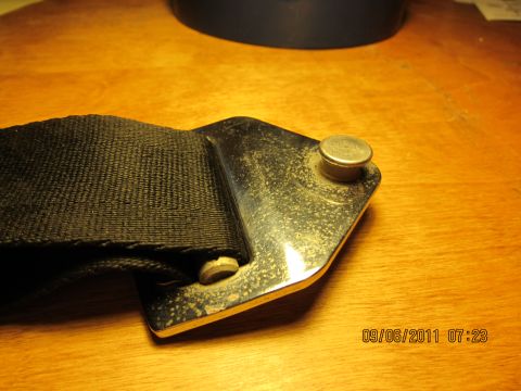 1969 Ford Mustang - Close-up of a seatbelt buckle and strap, with a timestamp visible in the corner.