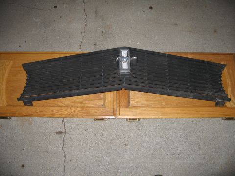 1969 Ford Mustang - Front grille assembly for a 1969 Ford Mustang, the iconic running horse emblem.