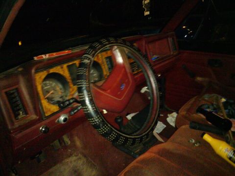 1988 Ford Ranger - The interior of an older model truck shows its dashboard, steering wheel, and passenger seat.