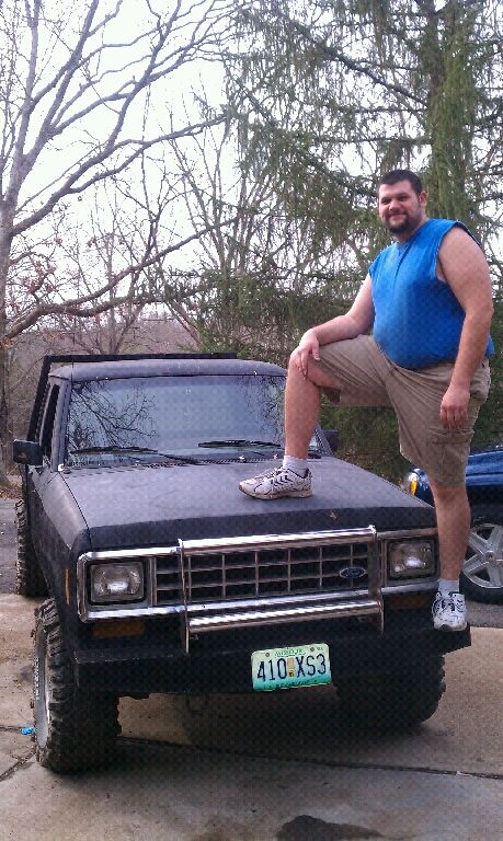 1988 Ford Ranger - Man poses on the hood of a 1988 Ford Ranger pickup truck.
