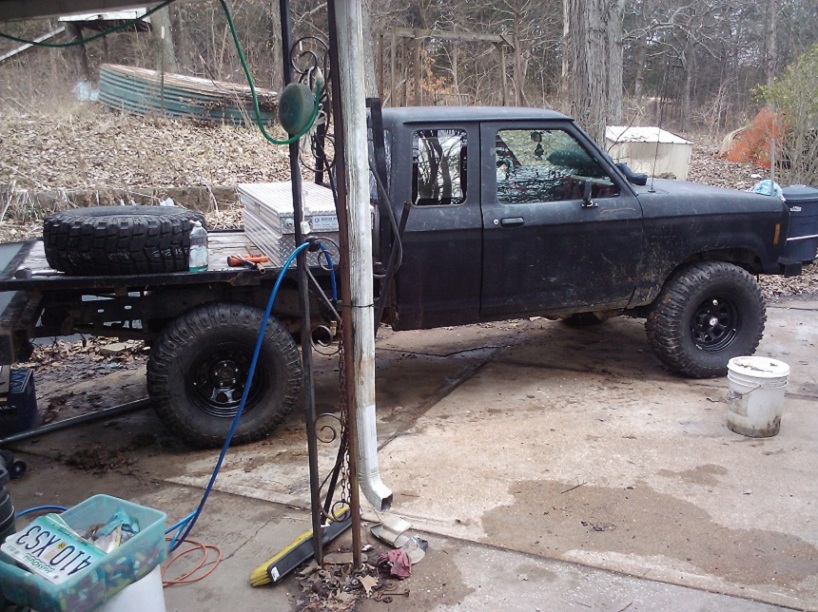 Black flatbed pickup truck with large tires, 1988 Ford Ranger