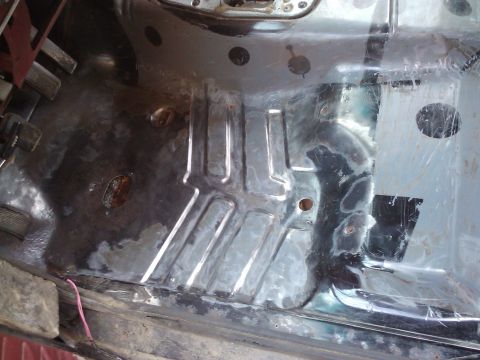 1988 Ford Ranger - Vehicle floor pan interior, showing metal bracing and signs of wear and tear.