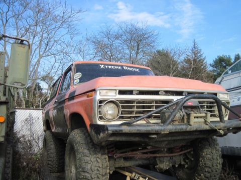 1978 Ford Bronco - This modified Ford Bronco features a prominent winch and a custom sticker on the windshield.