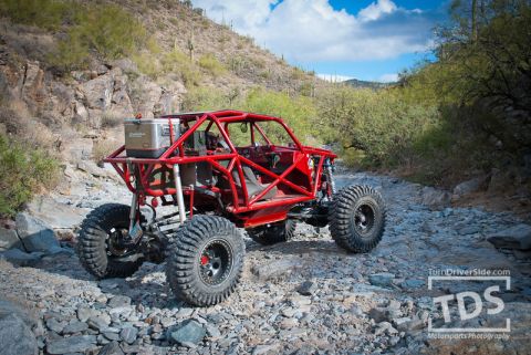 Suzuki Samurai - This custom off-road buggy navigates a desert landscape.
