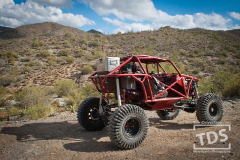 Suzuki Samurai - This custom buggy is built for off-road terrain with its reinforced frame and suspension.